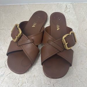 Brown leather Prada buckle sandals